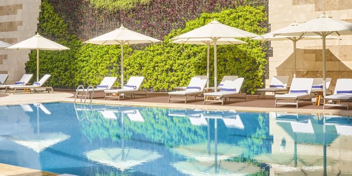 Swimming pol and sun loungers