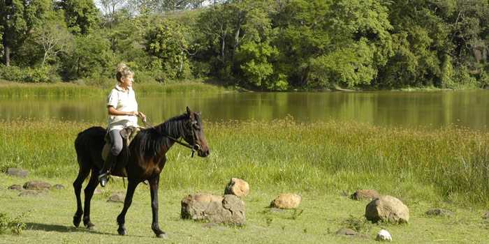 Horse riding by the lake