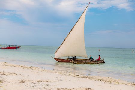 A traditional sailboat on a beach on Zanzibar Island